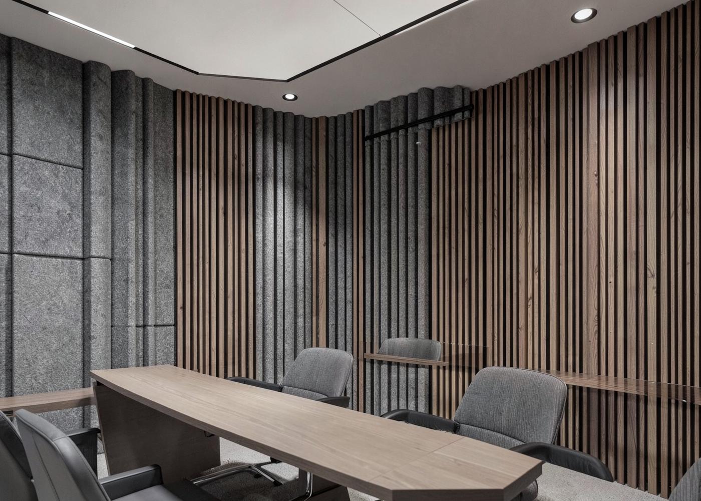 Sala de reuniones con paneles acústicos de fieltro y lamas de madera